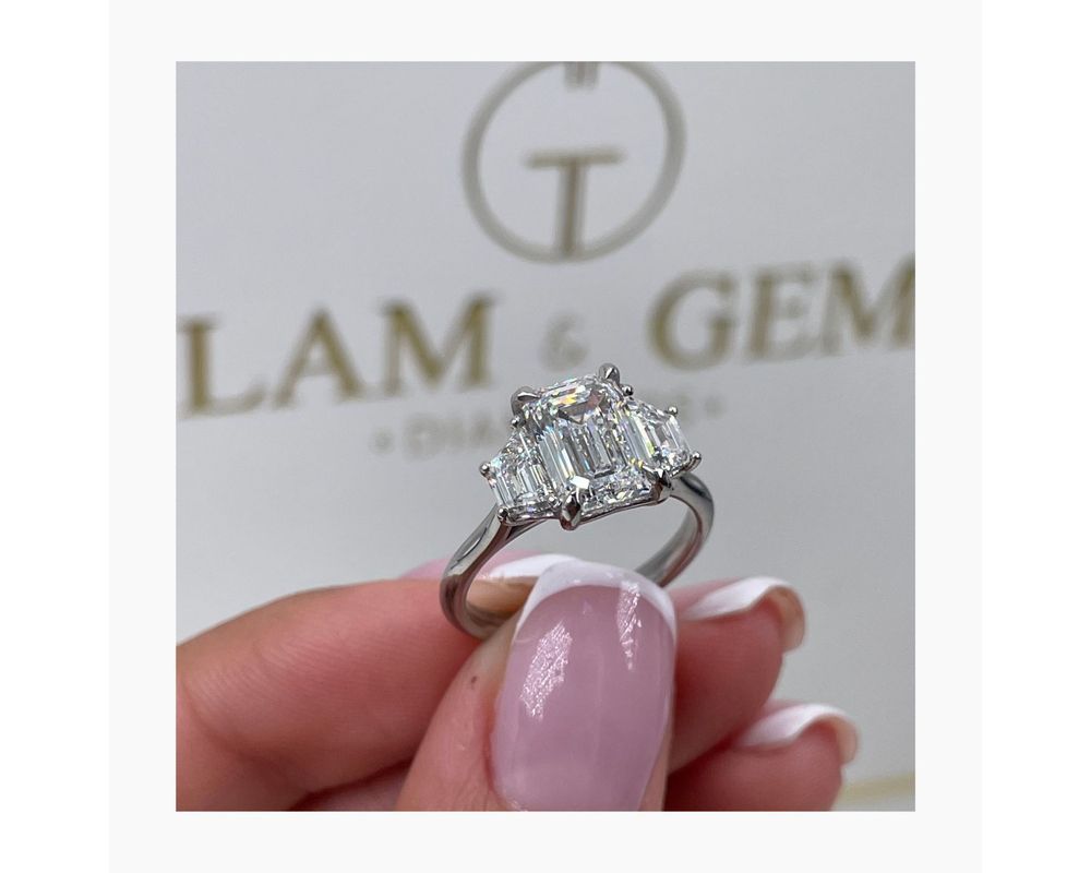 3 stone emerald cut engagement rings